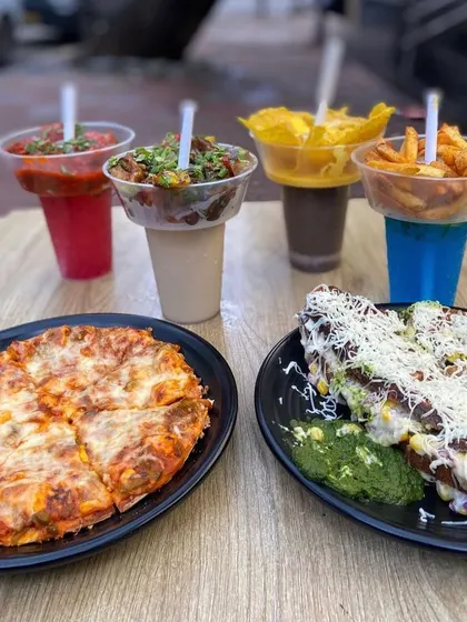 A complete meal spread featuring my Freyo Towers, a cheesy pizza, and my famous Italian sandwich.