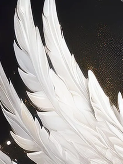 An artistic close-up of the white angel wings, showing the delicate feather details and glittering accents used to create my fantasy portraits.