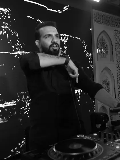 A more candid black and white shot, captured mid-sentence or mid-song. The passion is evident.