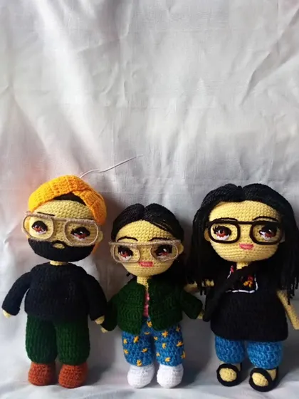 I love creating entire family sets. Here is a custom crochet family portrait, with each member designed based on photos to capture their individual look and style.