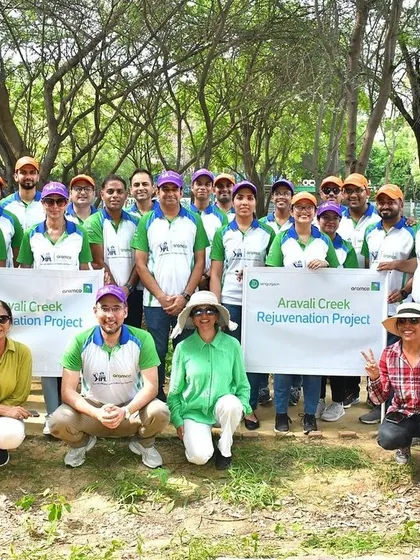 The Aramco team poses with our founder and volunteers after inaugurating and planting at Stretch 1 of Aravali Creek, a site vital for flood prevention.