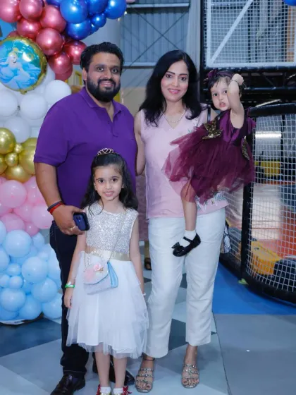 A beautiful family photo taken during a birthday celebration, capturing a happy memory.
