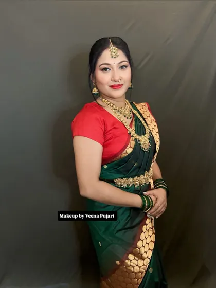 A beautiful client ready for her event. The makeup is classic and elegant, with a bold red lip that suits her perfectly.