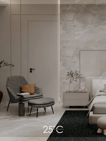A clean view of the harmonious and minimalist bedroom. The space uses a subtle grey marble wall, a simple bed frame, and a statement armchair to create a feeling of understated luxury and calm.