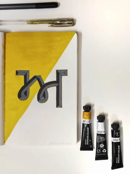 This is the Gurmukhi letter 'ਅ' (Aira), done in a bevel style with gouache paint. I love the combination of the bright yellow background with the grey and black shading.