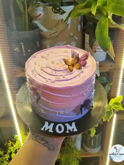 My butterfly and ombre cakes are a customer favorite. The gradient of colors, delicate butterflies, and pearl details create a dreamy and elegant look for any occasion.