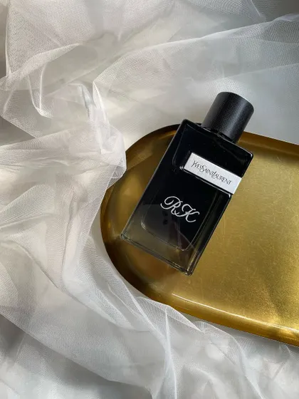 Minimal elegance. This Yves Saint Laurent perfume bottle is engraved with simple initials, 'RK', for a clean, sophisticated, and timeless look.