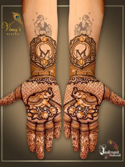 A personalized design with the initial 'M' on the arms and elephants on the palms.
