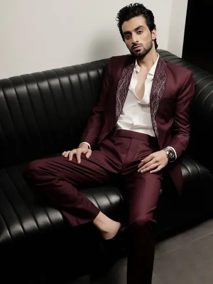 A full-length view of the burgundy tuxedo, showing its impeccable tailoring and modern fit. This is how we interpret classic dressing for the contemporary man.