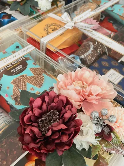 "The difference between something good and something great is attention to detail." This close-up shot of the floral arrangement on our acrylic trunk embodies our philosophy, showing the care we put into every final touch.