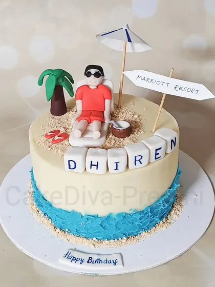 Don't worry, beach happy! This beach-themed cake sets a relaxing scene with edible sand, a fondant palm tree, and a figure lounging by the water. It's a butterscotch cake with chocolate ganache.