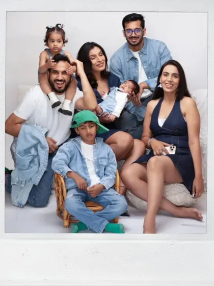 A large, happy extended family portrait. We welcome grandparents, aunts, and uncles to join in the photoshoot to capture the entire family's love.