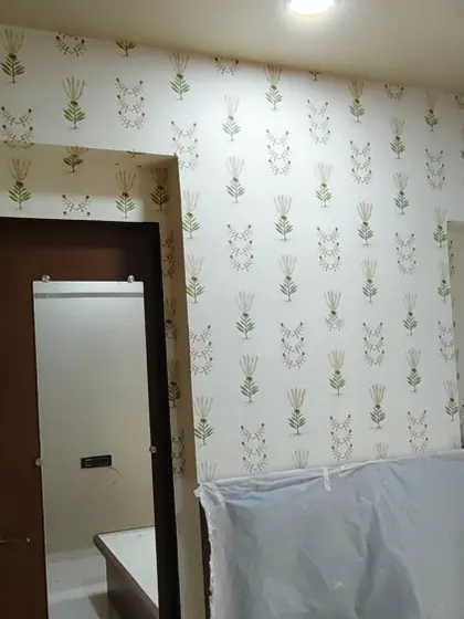 A simple yet elegant wallpaper with a repeating block-print style motif. This installation shows how I work around doorways and corners for a clean finish.