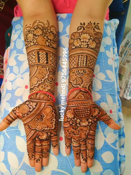 This full-arm design is packed with detail. It features floral bands, peacock motifs, and intricate geometric fillers for a rich and luxurious look.