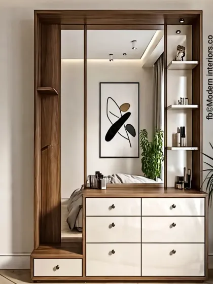 This modern dressing table features a large mirror and a combination of white drawers and wood framing. The asymmetrical shelving provides ample space for cosmetics and decor, creating a functional and stylish vanity area.