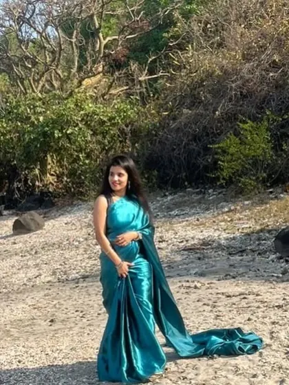 For a unique pre-wedding look, I offer pre-stitched sarees like this beautiful turquoise one. It gives you the elegance of a saree with the comfort and ease of a gown.
