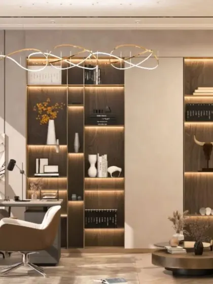 A luxurious home office design with dark wood tones and integrated shelving with accent lighting. The large desk and comfortable seating create an executive-level workspace at home.