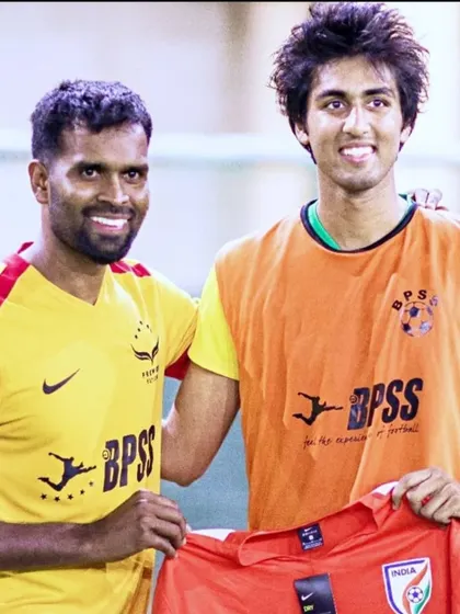 A younger Nakul Jain receiving his jersey from me. This marks a significant moment in his long and successful journey with BPSS.
