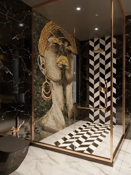 Step into a luxurious sanctuary with this exquisite washroom. It features a stunning hand-laid mosaic artwork in the shower, a black marble vanity, and gold fixtures, redefining relaxation and indulgence.