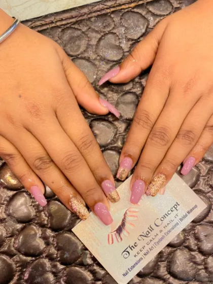 A beautiful combination of mauve and gold on long coffin nails. The design features a gold glitter ombre effect on the tips for a touch of glamour.