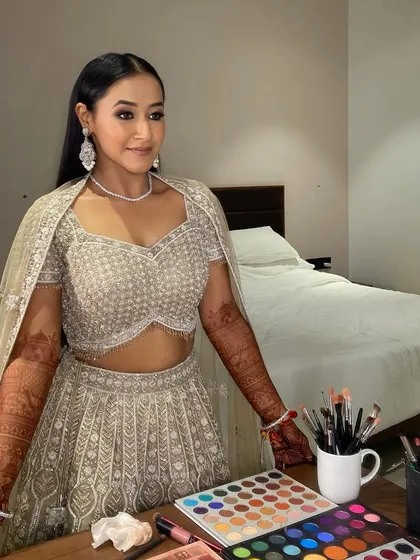 A mirror-view of this stunning bride, ready for her sangeet. The glam smokey eye and sleek hair create a powerful and sophisticated look.