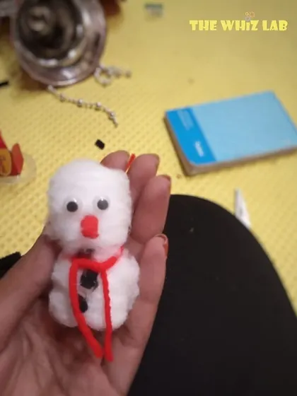 A cute little snowman made from cotton and craft supplies. This was one of the simple, fun activities from our Christmas camp, perfect for our younger 5-year-old scientists.