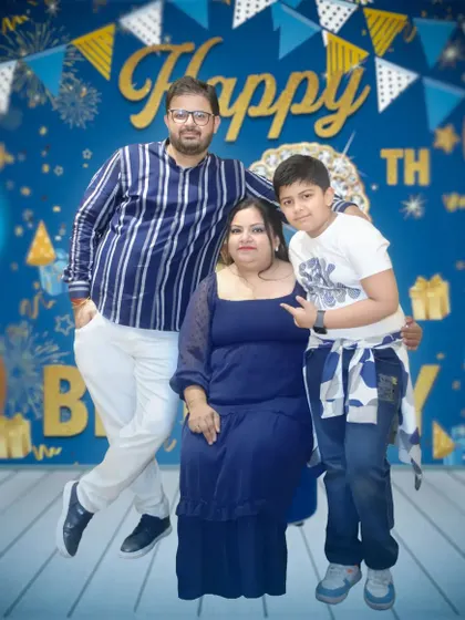 A family portrait using a digitally added "Happy Birthday" background, a service I offer for posed shots.