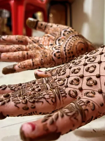 A close-up shot showing the texture and detail of the henna paste right after application.