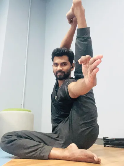 Holding Heron Pose with a steady gaze. This asana teaches patience and the importance of breathing through discomfort to find ease.