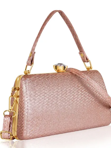 An angled shot of a pink clutch, providing a sense of its depth and shape on a clean white background.