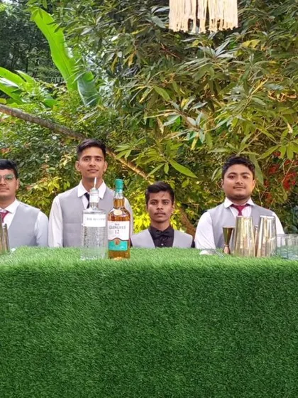 For a fresh, natural aesthetic, our green turf-fronted bar is an excellent choice for daytime events or garden parties. Here, it's set up for a Diwali card party, blending seamlessly with the outdoor greenery.