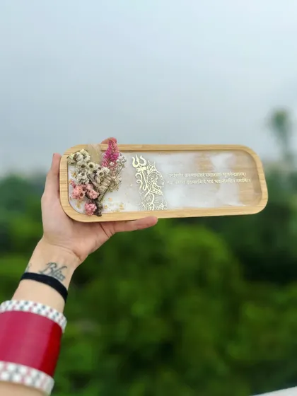 Holding the Mahadev tray against the sky. The natural light brings out the soft, marble-like effect of the white resin.