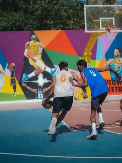 Making a move against a defender in a 3x3 game.