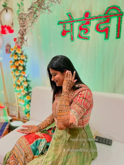 A graceful pose from our Nashik bride, showcasing her stunning henna.