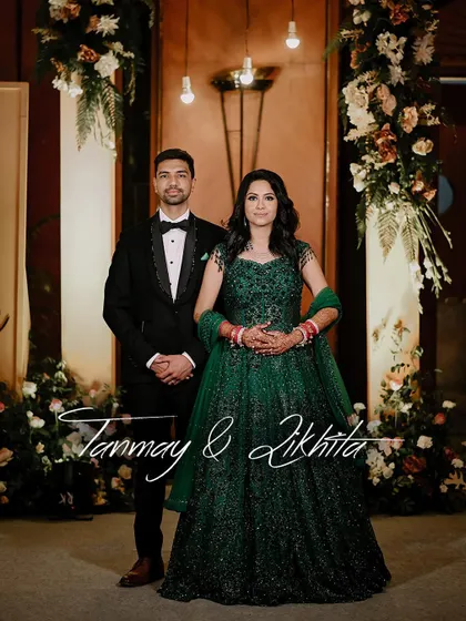 A classic full-length portrait of the couple on their reception stage.