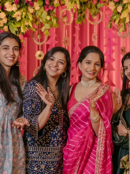 The bride posing with her bridesmaids at her mehndi ceremony. This photo captures the friendship and excitement of the bride tribe.