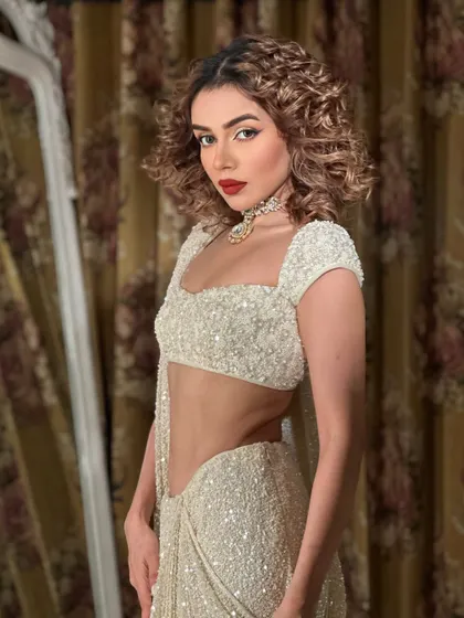 Goddess. Komal Pandey channeling her inner diva with curly hair and a bold red lip. A look that is pure fire.