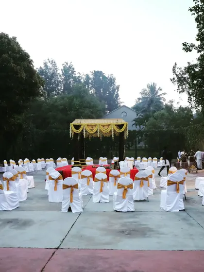 A different angle of the outdoor ceremony seating, showing the organized rows of chairs ready for guests. Proper seating arrangement is key to a comfortable guest experience.