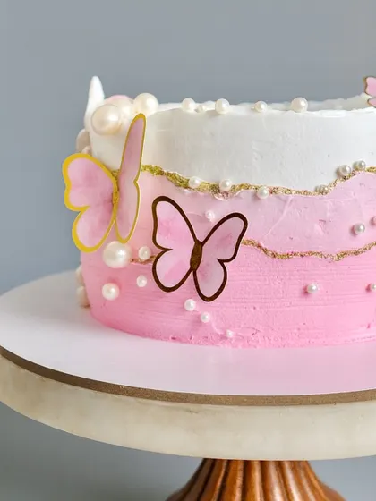 This dreamy fault line cake is dressed in butterflies and pearls, making it perfect for a special birthday or celebration. Inside, it’s loaded with fresh fruits, creating a dessert that is as delicious as it is beautiful.