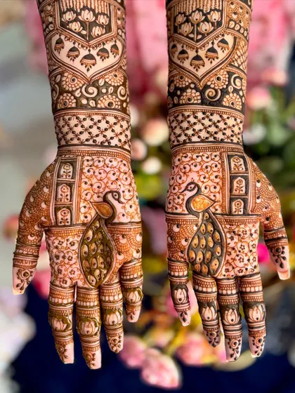 A close-up of the peacock motifs on the palms from the bridal design.