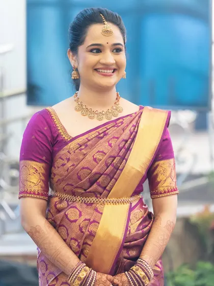 A bright and happy photo of the bride-to-be. Her smile is the centerpiece, enhanced by a simple and elegant makeup application.