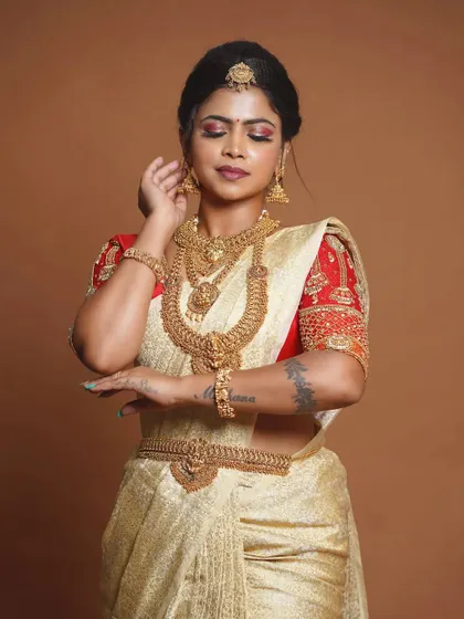 This bride is wearing a stunning antique set with a golden saree, a classic and timeless look.