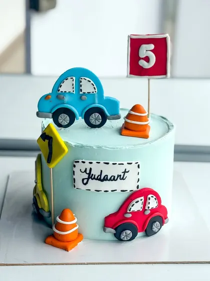 This version of the car cake was for a 5th birthday, complete with a custom number sign.