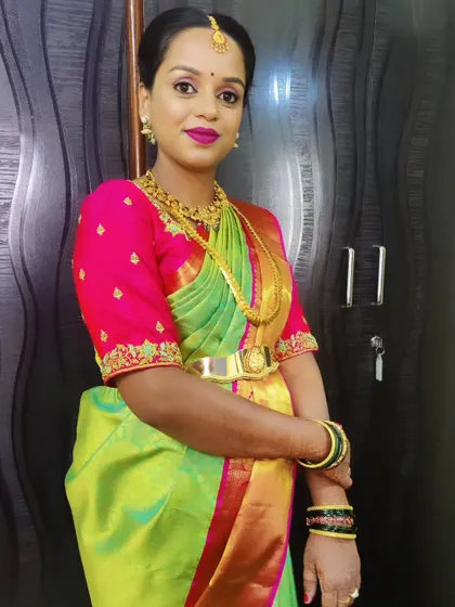 Another angle of Jamuna's baby shower look, showing how the makeup looks from the side. The hairstyle is a simple, elegant updo perfect for the occasion.