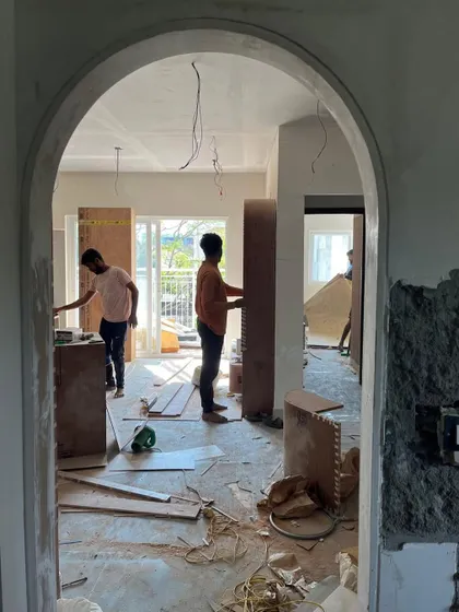 The storm before the calm. An archway frames the beautiful chaos of a project in full swing, with our team working diligently in the background.