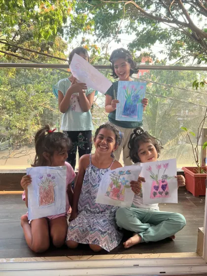 Magical smiles and beautiful flower vase drawings. This was a perfect summer art activity, full of color and sunshine.
