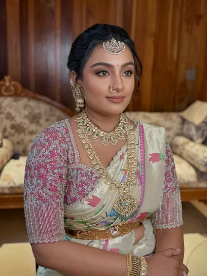 A portrait of the bride for her Bangle ceremony. The makeup is soft and glowing, with a focus on flawless skin and a neutral lip.
