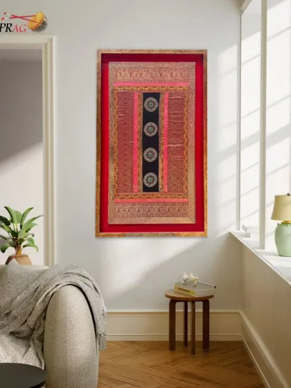 A traditional Indian textile artwork, beautifully preserved in a custom frame that complements its rich colors and intricate details.