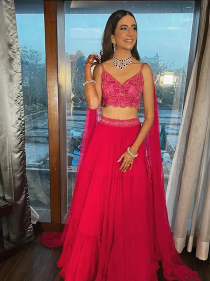 This is what a dream engagement look is made of. I styled Rhea in this vibrant fuchsia pink lehenga with an embroidered crop top and a delicate diamond necklace, creating a look that is modern, fresh, and absolutely stunning.
