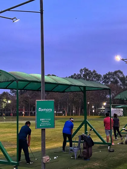 The range at twilight, with the lights just beginning to take over from the fading sun.